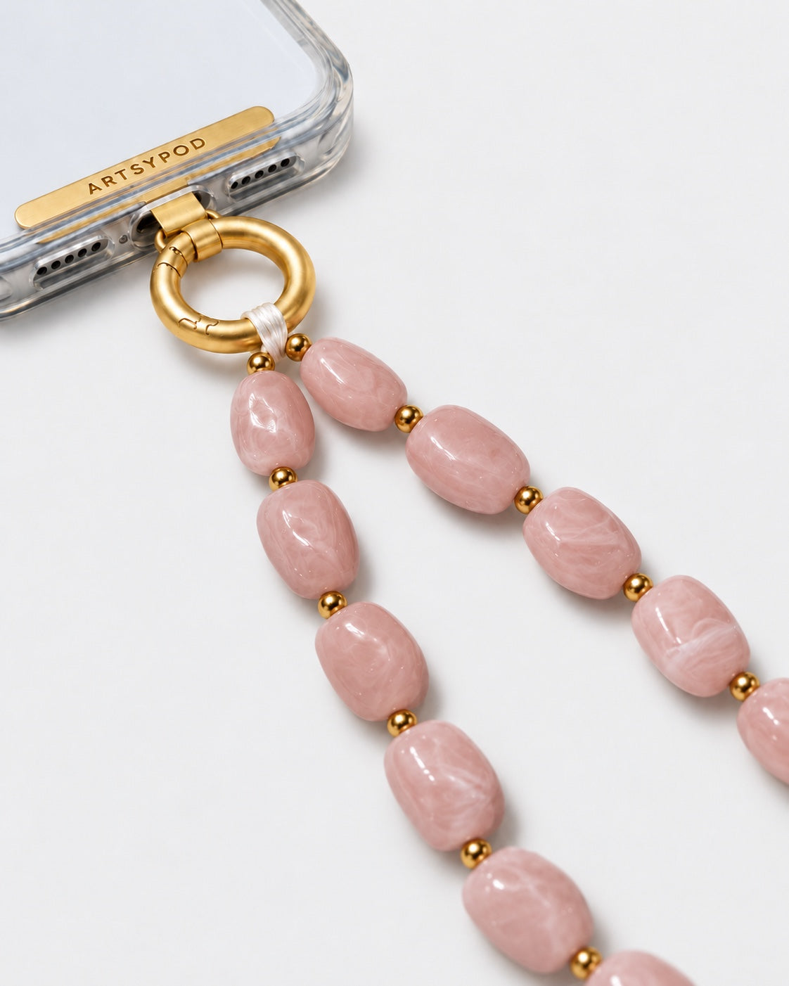 ARTSYPOD Blush Pink Marble wristlet close-up attached to phone case